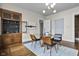 Dining room featuring a modern table, chairs, and built-in wooden cabinet at 434 E New York St, Indianapolis, IN 46202