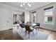 Elegant dining room with modern lighting and stylish furniture visible from living room at 434 E New York St, Indianapolis, IN 46202