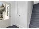 Bright entryway with a staircase, wooden flooring, and a glass panel entry door at 434 E New York St, Indianapolis, IN 46202