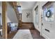 Inviting foyer showcasing a wooden staircase and a bright, airy entrance at 434 E New York St, Indianapolis, IN 46202