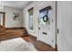 Bright foyer with a wooden staircase, traditional window, and a welcoming front door at 434 E New York St, Indianapolis, IN 46202