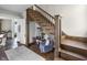 Elegant foyer featuring a wooden staircase, stylish decor, and an open doorway at 434 E New York St, Indianapolis, IN 46202