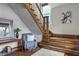 Beautiful foyer with a wooden staircase, elegant decor, and a cozy seating area at 434 E New York St, Indianapolis, IN 46202