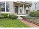 Inviting front porch featuring a decorative wreath and a brick pathway at 434 E New York St, Indianapolis, IN 46202