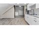 This kitchen features white cabinets, stainless steel appliances, with wood look tile at 434 E New York St, Indianapolis, IN 46202