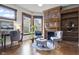 Inviting living room featuring a cozy brick fireplace, hardwood floors, and natural light at 434 E New York St, Indianapolis, IN 46202