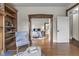 Bright living room features beautiful hardwood floors, built-in shelves, and an archway to the bedroom at 434 E New York St, Indianapolis, IN 46202