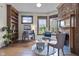 Cozy living room featuring a brick fireplace, hardwood floors, and well lit windows at 434 E New York St, Indianapolis, IN 46202
