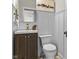 Elegant powder room featuring a modern vanity, stylish mirror, and gold fixtures at 434 E New York St, Indianapolis, IN 46202