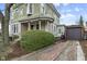 Captivating exterior showcasing a brick driveway leading to a detached garage at 434 E New York St, Indianapolis, IN 46202