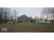 Spacious backyard with mature trees, play set, above ground pool, and privacy fence at 4743 Little Hurricane Rd, Martinsville, IN 46151