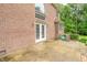 Backyard featuring a brick home, a patio, and mature landscaping at 4743 Little Hurricane Rd, Martinsville, IN 46151