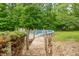 A wooden boardwalk goes to the backyard pool surrounded by trees and nature at 4743 Little Hurricane Rd, Martinsville, IN 46151