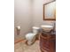 Cozy half bathroom features vanity with vessel sink and toilet with decorative tile floor at 4743 Little Hurricane Rd, Martinsville, IN 46151