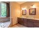 Bathroom includes double sinks, vanity with dark cabinets, and large window at 4743 Little Hurricane Rd, Martinsville, IN 46151