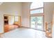 Foyer with tile floors, high ceilings, a large window, and access to a living space through a doorway at 4743 Little Hurricane Rd, Martinsville, IN 46151
