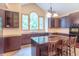 Kitchen with brown cabinets, granite counters, stainless appliances and a large window letting in lots of light at 4743 Little Hurricane Rd, Martinsville, IN 46151