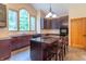 Kitchen with brown cabinets, granite counters, stainless appliances and a large arched window letting in lots of light at 4743 Little Hurricane Rd, Martinsville, IN 46151