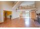 Spacious living room with hardwood floors, fireplace, and tall ceilings that let in ample natural light at 4743 Little Hurricane Rd, Martinsville, IN 46151