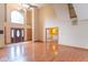Open concept living room with hardwood floors, high ceilings, chandelier, and large windows at 4743 Little Hurricane Rd, Martinsville, IN 46151