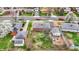 Aerial view of the neighborhood with mature trees, well-manicured lawns, and nearby amenities at 5440 Maplewood Dr, Indianapolis, IN 46224