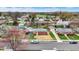 Neighborhood scene with a mix of charming homes and mature trees on well maintained lawns at 5440 Maplewood Dr, Indianapolis, IN 46224