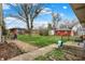 Nice backyard with a mature tree and ample space for outdoor activities at 5440 Maplewood Dr, Indianapolis, IN 46224