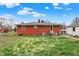 Home backyard featuring a well maintained lawn and detached garage at 5440 Maplewood Dr, Indianapolis, IN 46224