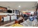 Finished basement features a tv, seating, table, and bar at 5440 Maplewood Dr, Indianapolis, IN 46224