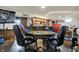 Basement room with table, chairs, stools, and bar at 5440 Maplewood Dr, Indianapolis, IN 46224