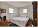 Sun-filled bedroom featuring hardwood floors, and two windows for lots of natural light at 5440 Maplewood Dr, Indianapolis, IN 46224