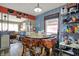 Dining area featuring a rustic table, distinctive wood chairs, and open access to the living room at 5440 Maplewood Dr, Indianapolis, IN 46224