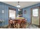 Charming dining area with rustic table, unique wood chairs, and cozy decor at 5440 Maplewood Dr, Indianapolis, IN 46224