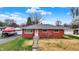 Classic brick ranch home with a well-maintained lawn and charming curb appeal at 5440 Maplewood Dr, Indianapolis, IN 46224