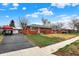 Charming brick home with a well-maintained lawn and driveway at 5440 Maplewood Dr, Indianapolis, IN 46224