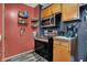 Well-lit kitchen featuring stainless steel appliances and plenty of cabinet space at 5440 Maplewood Dr, Indianapolis, IN 46224