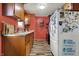Well-organized kitchen with wood cabinets, ample counter space, and a modern refrigerator at 5440 Maplewood Dr, Indianapolis, IN 46224