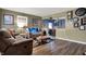 Inviting living room with hardwood floors, comfortable seating, and open access to the dining area at 5440 Maplewood Dr, Indianapolis, IN 46224