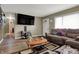 Cozy living room with hardwood floors, comfortable seating, and an inviting atmosphere at 5440 Maplewood Dr, Indianapolis, IN 46224