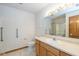 Bathroom featuring light wood cabinets, a single sink, and a shower with sliding glass doors at 546 Treyburn Lakes Way, Indianapolis, IN 46239