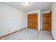 Modest bedroom features carpet, neutral walls, closet, and view of hall at 546 Treyburn Lakes Way, Indianapolis, IN 46239