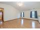 Bright bedroom featuring two windows, neutral paint, and laminate flooring at 546 Treyburn Lakes Way, Indianapolis, IN 46239