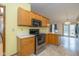 Well-equipped kitchen with ample counter space and stainless steel appliances at 546 Treyburn Lakes Way, Indianapolis, IN 46239