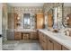 Modern bathroom with double sinks, ample counter space, patterned wallpaper, and a walk-in shower at 583 Exmoor Dr, Carmel, IN 46032