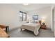 Serene bedroom with natural light, complemented by soft textures and classic design elements at 583 Exmoor Dr, Carmel, IN 46032