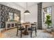 Elegant dining room with modern lighting, a large window, stylish wallpaper, and a round table at 583 Exmoor Dr, Carmel, IN 46032