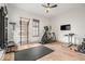 Bright home gym with natural light, complete with modern exercise equipment and sleek flooring at 583 Exmoor Dr, Carmel, IN 46032