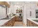 Spacious kitchen showcasing sleek countertops, a gas range, modern appliances, and custom cabinetry at 583 Exmoor Dr, Carmel, IN 46032