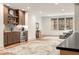 Finished basement living room features wet bar, comfortable seating, and natural light at 583 Exmoor Dr, Carmel, IN 46032