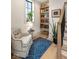 Charming reading nook with a comfortable armchair, bookshelf, and natural light at 583 Exmoor Dr, Carmel, IN 46032